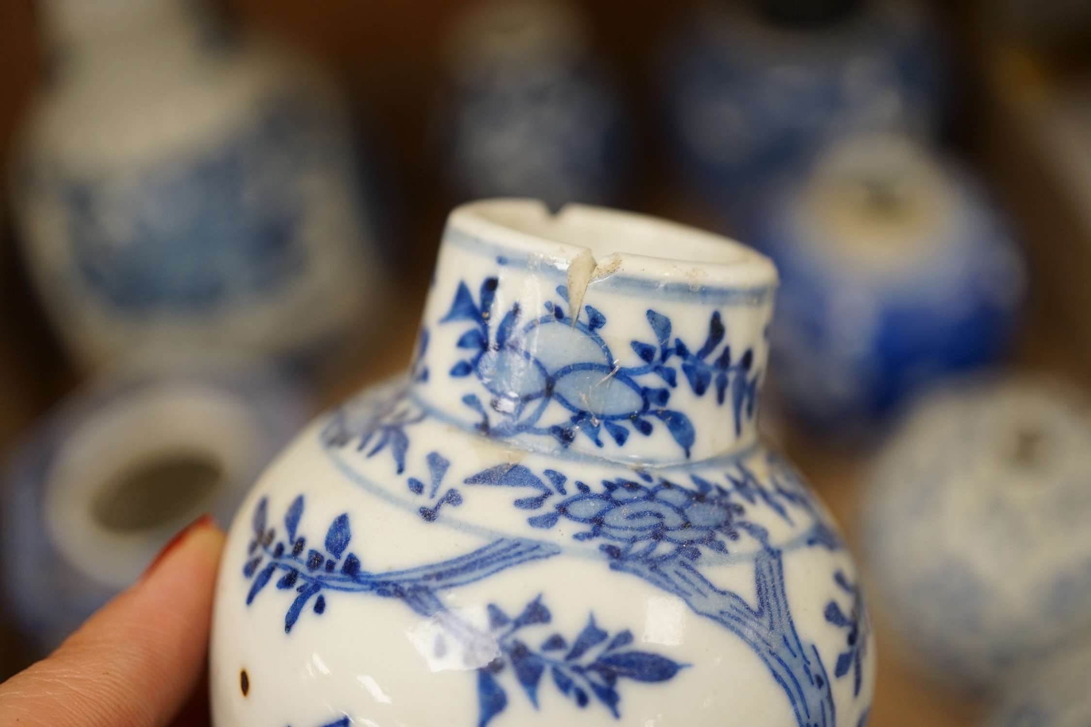 A collection of 18th - early 20th century Chinese blue and white porcelain vases, jars and spare covers, together with some Japanese blue and white ceramics, tallest 21cm